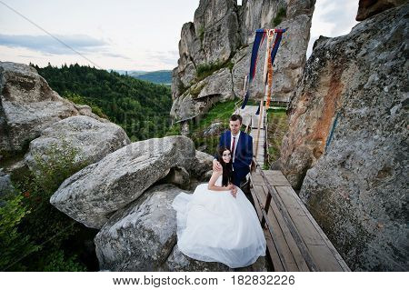 Lovely Wedding Couple Against Rocks Of Fortess Tustan At Carpathian Mountains.