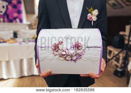 wedding box for storing money in the hands of men witness