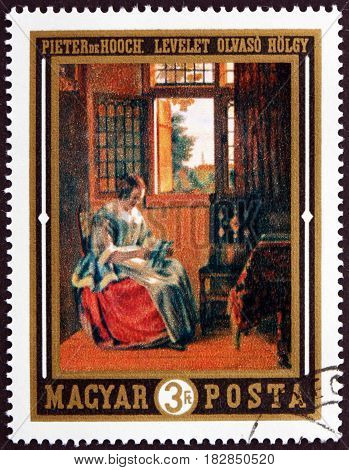 HUNGARY - CIRCA 1969: a stamp printed in Hungary shows Woman Reading Letter Painting by Pieter de Hooch Dutch Painter circa 1969