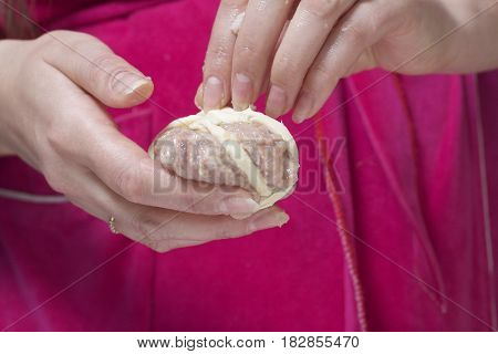 Preparation Of Meat Glomeruli. Stuffed Turkey, Wrapped In Strips Of Puff Pastry. A Woman Winds A Str