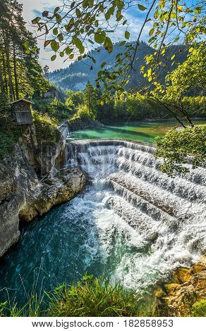 Lech Waterfall in autumn. German countryside on a sunny day