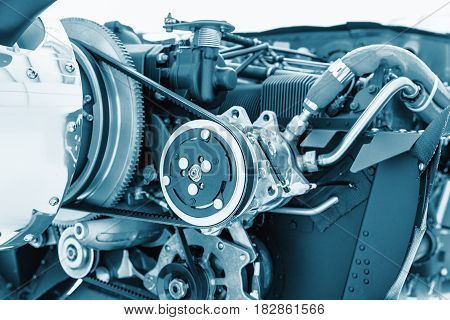 Aircraft engine detail. Piece of equipment of the aircraft engine closeup blue colored. View of an aircraft engine.
