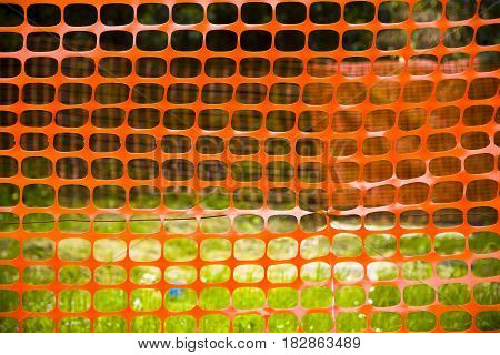 Orange construction grid around a construction site