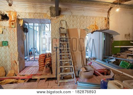 Interior of apartment with materials during on the renovation and construction ( remodel wall from gypsum plasterboard or drywall)