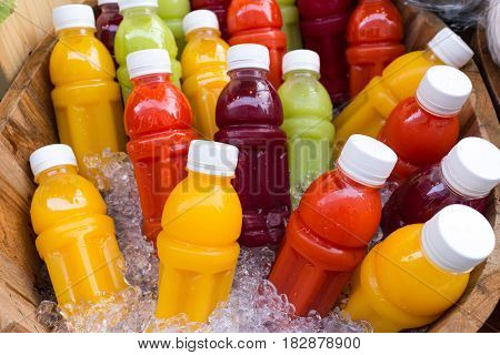 Colorful of vegetable and fruit juice carrot apple guava orange on ice