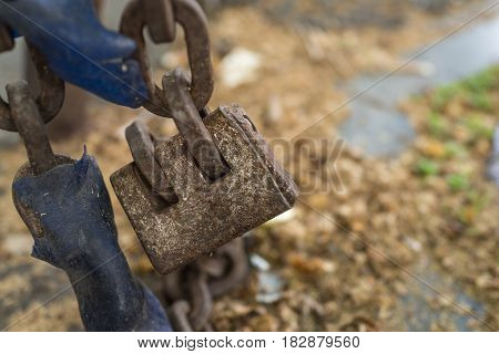 Closed up of old padlock chain lock as safety and security or eternity concept