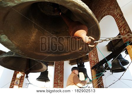 Orel Russia - April 20 2017: Orthodox bell-ringing festival. Church bells in bell tower closeup