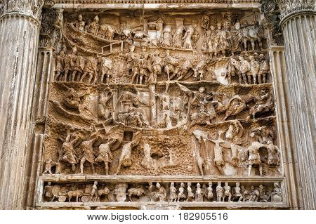 Detail of the bas-relief of the arch of Septimius Severus at the Roman Forum, Rome, Italy. The Roman Forum is the remains of architecture of the Roman Empire and is one of the main tourist attractions of Rome.