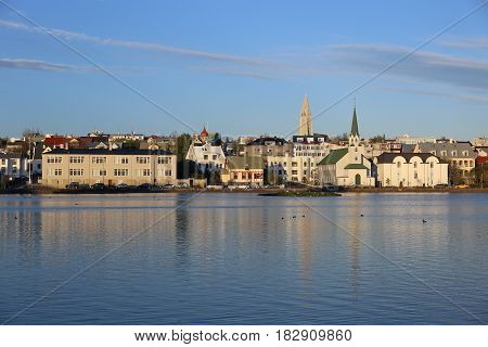 Pond in front of the skyline of Reykjavik