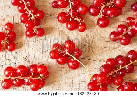 Fresh ripe currant on wooden background close up