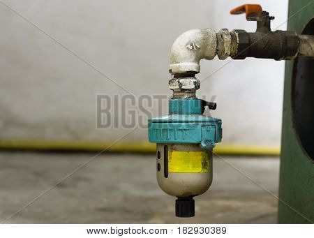 Close Up Auto Valve Drainvalve Used To Drain Water From The Pressure Tank In A Factory.