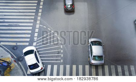 car city street on top view run on the pedestrian crosswalk sign on and turn left at intersection on ciity road (Aerial city road view)