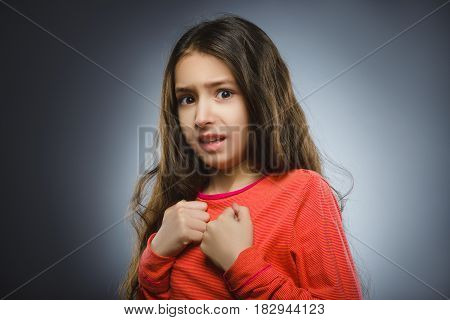 Closeup Scared and shocked little girl. Human emotion face expression.