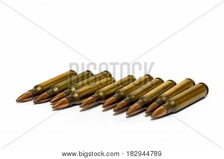 5.56x45mm NATO intermediate cartridges isolated on white background.