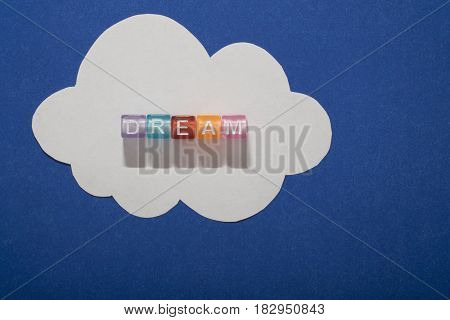DREAM, by colorful alphabet beads with white paper cloud