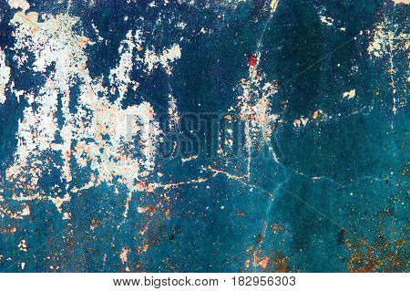 Fragment of old grungy texture with chipped paint and cracks or orange red blue concrete wall and cement surface