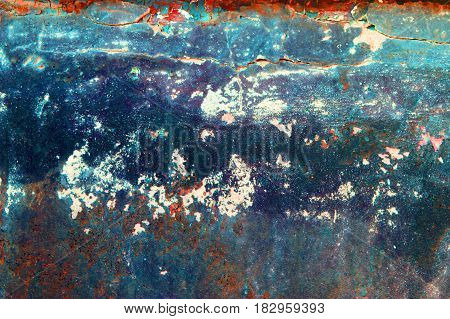 Fragment of old grungy texture with chipped paint and cracks or orange red blue concrete wall and cement surface