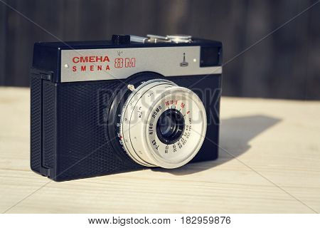 Borotin, Czech Republic - March 25: Smena 8M Old Vintage Filtered Camera On Wooden Background On Mar