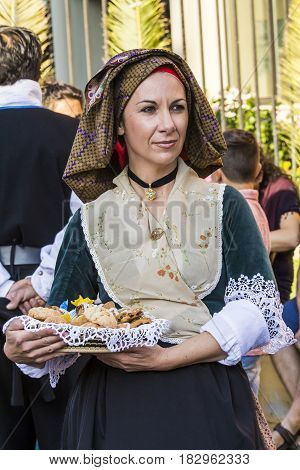 SELARGIUS, ITALY - SEPTEMBER 14, 2014: Ancient celibacy selargino - portrait of a beautiful woman dressing in traditional Sardinian costume - Sardinia