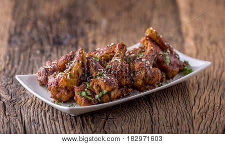 Chicken wings. Fried chicken wings in white bowl garlic dressing ketchup and potato fries.