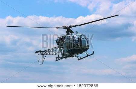 helicopter fly near the forest at iron chain