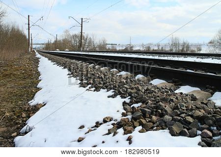 rails of railway forward go into distance at winter
