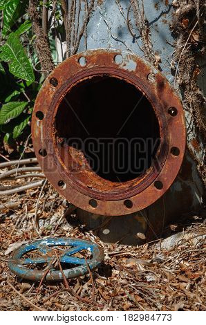 old rusty industrial tap water pipe and valve.