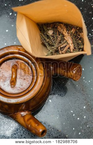 top view herbal near to an enamel pot