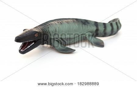 a Mosasaurus toy on a white background