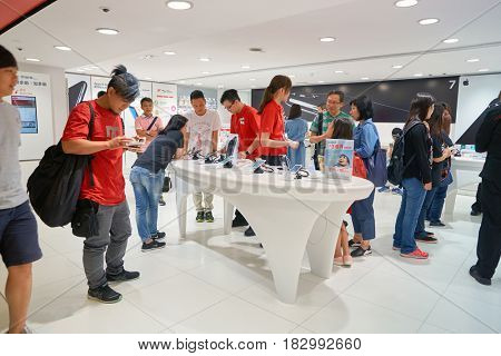 HONG KONG - CIRCA NOVEMBER, 2016: people at SmarTone shop. SmarTone Telecommunications Holdings Limited is a wireless communications carrier with operating subsidiaries in Hong Kong and Macau.