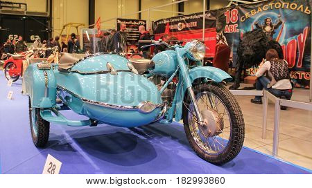 St. Petersburg Russia - 15 April, Soviet motorcycle with a stroller IZH.,15 April, 2017.
International Motor Show IMIS-2017 in Expoforurum.
Motorcycles and motoconcepts presented at St. Petersburg Motor Show.