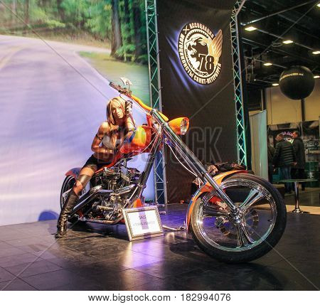 St. Petersburg Russia - 15 April, A fashion model on a motorcycle,15 April, 2017.
International Motor Show IMIS-2017 in Expoforurum.
Models on motorcycles presented at the motor show.