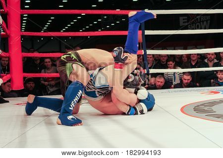 St. Petersburg Russia - 15 April, Plexus fighters in the ring,15 April, 2017.
International Motor Show IMIS-2017 in Expoforurum.
Fights without rules in the room in the ring.