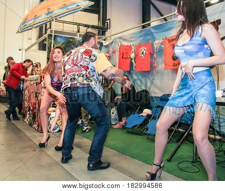 St. Petersburg Russia - 15 April, Dancing in public,15 April, 2017.
International Motor Show IMIS-2017 in Expoforurum.
Erotic dances of the girls at the motor show.
