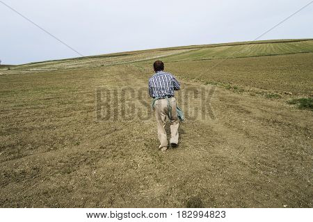 Farmers who fertilize the field with primitive methods, fertilized field pictures, agricultural fertilizer