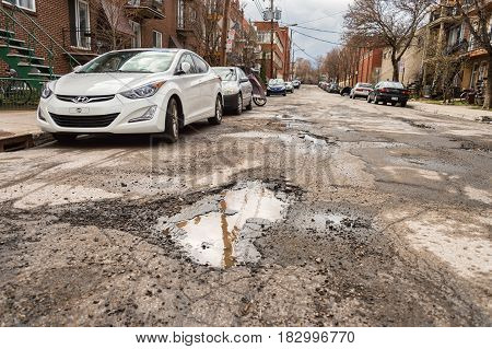 Montreal, Canada - 21 April 2017: Large Unrepaired Potholes On Chabot Street