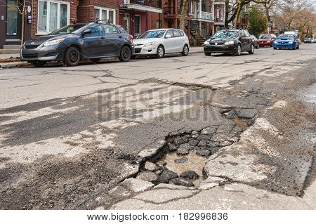 Montreal, Canada - 21 April 2017: Large Unrepaired Pothole On Gilford Street