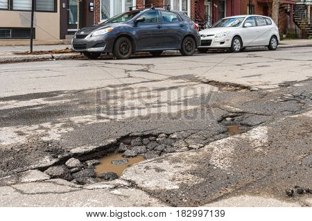 Montreal, Canada - 21 April 2017: Large Unrepaired Pothole On Gilford Street
