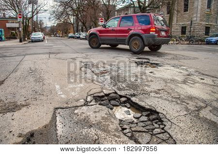 Montreal, Canada - 21 April 2017: Large Unrepaired Pothole On Gilford Street
