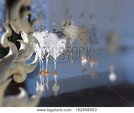 Blurry background / metal heart pendant/ buddism