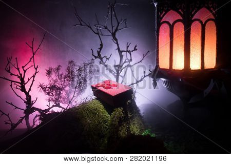 Night Wedding Ceremony With A Lot Of Vintage Lamps And Candles On Big Tree