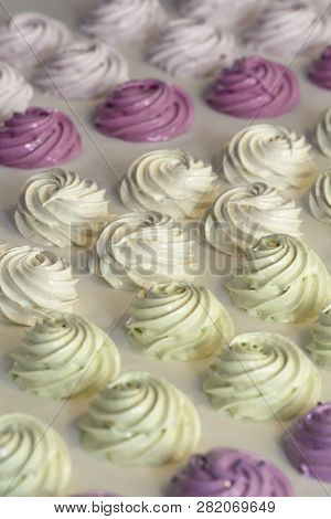 Colorful Zephyr  On White Wooden Background.set Of Homemade White And Pink Zephyr Or Marshmallow On 