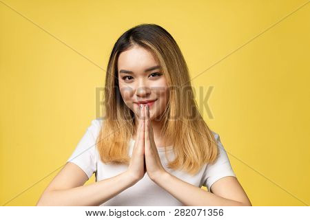 Tan Skin Female Model In White Shirt. Beauty Fashion Look Style In Yellow Background In Studio Light