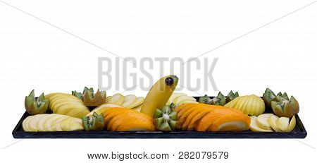 Sliced Mixed Fruit On The White Plate, White Background Isolated