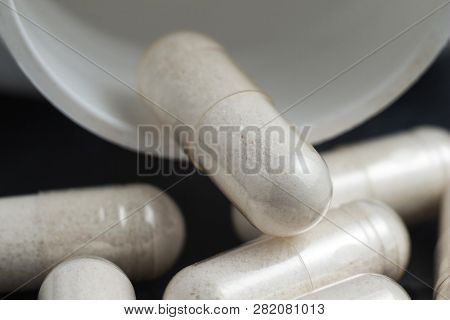 White Medical Capsules Of Glucosamine Chondroitin, Healthy Supplement Pills, Macro Image.
