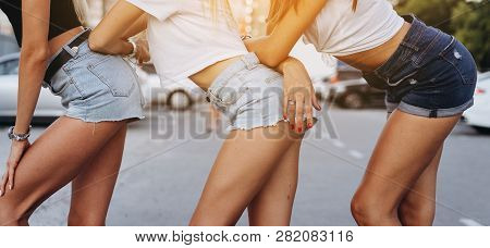 Close Up Photo Of Thre Shapely Girls In Jean Shorts