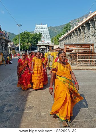 Tiruvanamalai, India - December 20, 2018: Indian women visiting the temple in Tiruvanamalai India