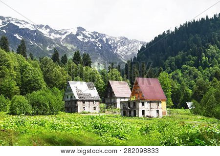 Old Abandoned Houses In Auadhara. Spring Mountain Landscape. Caucasus Mountains, Republic Of Abkhazi
