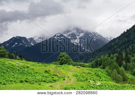 Country Road In The Spring Valley In The Mountains. Republic Of Abkhazia