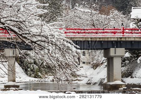 Nakabashi Bridge With Snow Fall And Miyakawa River In Winter Season . Landmark Of Hida , Gifu , Taka